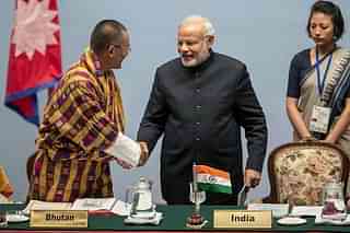 Bhutan Prime Minister Tshering Tobgay greets Narendra Modi during the inaugural session of the 18th SAARC Summit in Nepal. (Narendra Shrestha - Pool/Getty Images)