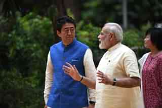 Japanese Prime Minister Shinzo Abe (L) with Prime Minister Narendra Modi (C) in Ahmedabad on 13 September 2017. (PRAKASH SINGH/AFP/GettyImages)