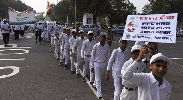 Students and workers participate during the Swachchta Rally flagged off by Union Minister Venkaiah Naidu at India Gate, in 2016, in New Delhi. (Sushil Kumar/Hindustan Times via Getty Images)