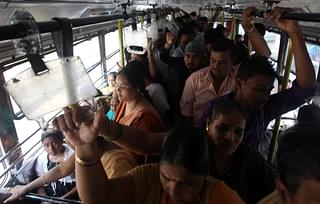 Women wade through a crowded bus (Anshuman Poyrekar/Hindustan Times via Getty Images)