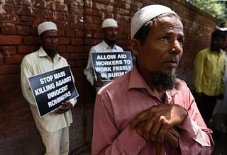 Rohingya Muslim refugees hold placards against human rights violations in Myanmar during a protest in New Delhi. (PRAKASH SINGH/AFP/Getty Images)