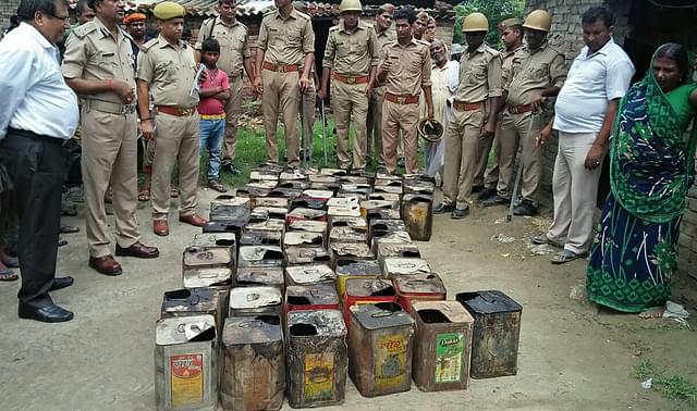 Recovered Hooch Tins in Uttar Pradesh (STR/AFP/Getty Images)