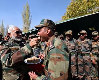 Prime Minister Narendra Modi exchanging sweets with Jawans (Narendra Modi/Twitter)