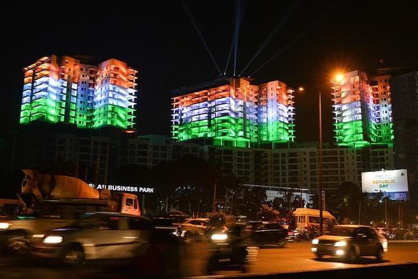 A row of apartment buildings is illuminated with the colours of the Indian national flag on the eve of Republic Day celebrations in Bangalore on January 25, 2016 (MANJUNATH KIRAN/AFP/Getty Images)