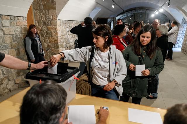 A woman casts her ballot at a polling station in Llado, on October 01, 2017, during a referendum on independence for Catalonia banned by Madrid. (CESAR MANSO/AFP/Getty Images)