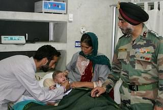 A soldier’s infant receives medical care.