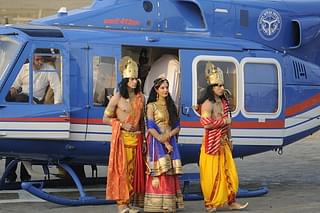 Artistes dressed up as Lord Rama, Sita and Lakshman who arrived by a chopper for Deepotsav celebrations on October 18, 2017 in Ayodhya, India. More than 1.7 lakh earthen lamps were lit up at the grand event while a chopper decorated as the mythological Pushpak Viman descended on the Ram Katha Park (Deepak Gupta/Hindustan Times)