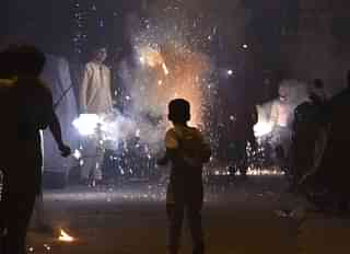 Children bursting fire-crackers in India (Raj K Raj/Hindustan Times via Getty Images)