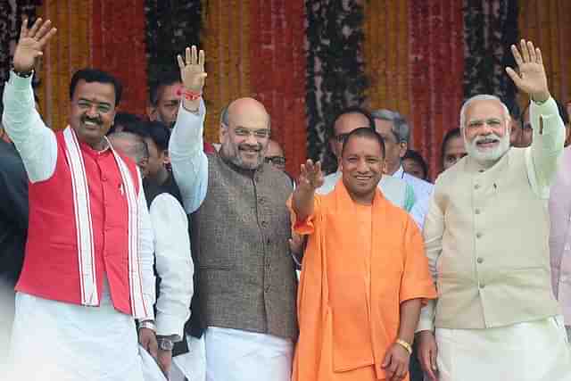 Chief Minister of Uttar Pradesh state Yogi Adityanath (C),  Prime Minister Narendra Modi (R), Bharatiya Janata Party (BJP) president Amit Shah and new deputy chief minister of Uttar Pradesh Keshav Prasad Maurya (L)(Sanjay Kanojia/AFP/Getty Images)