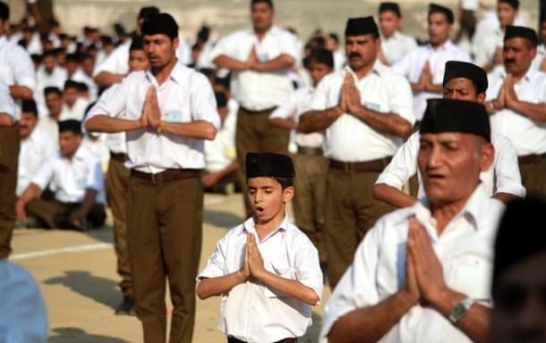 RSS volunteers performing yoga (Nitin Kanotra/Hindustan Times via Getty Images)
