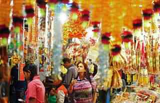 Indian shoppers browse decorative items at roadside stalls ahead of Diwali in Allahabad. (Sanjay Kanojia/AFP/GettyImages)