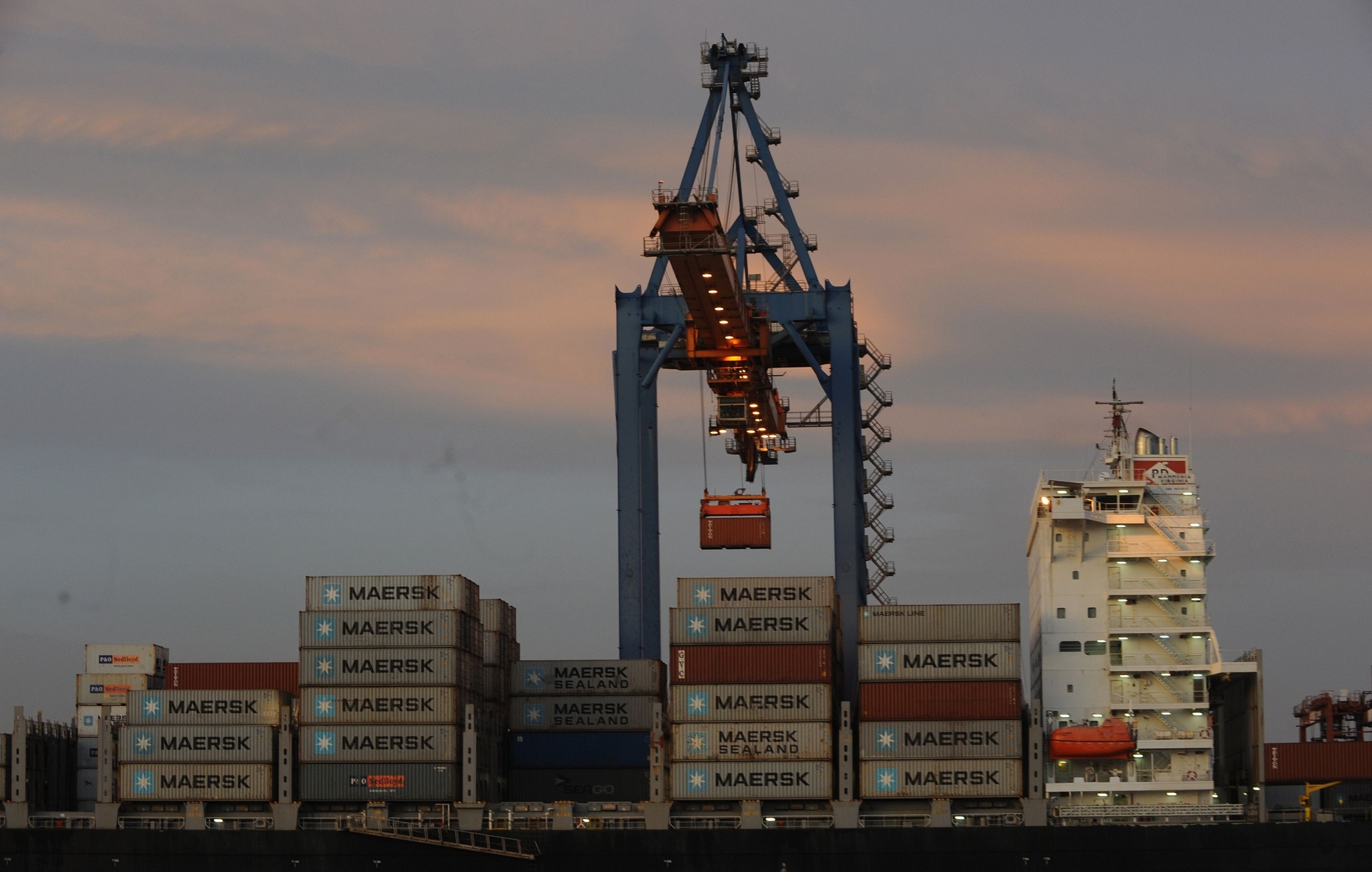 This September 21, 2017 photo shows a 
container being loaded onto a ship at the Vizag Terminal, operated by 
Essar Ports, India. (INDRANIL MUKHERJEE/AFP/Getty Images)

