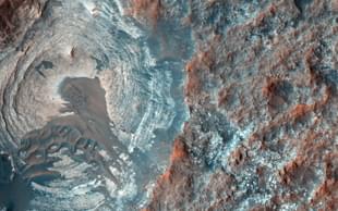 Circular depression on the surface of Mars. (NASA)