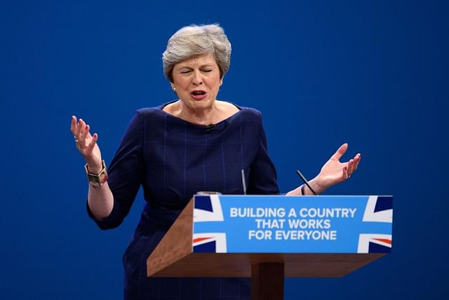  British Prime Minister Theresa May delivers her keynote speech to delegates and party members on the last day of the Conservative Party Conference at Manchester Central on October 4, 2017 in Manchester, England. The prime minister rallied members and called for the party to ‘shape up’ and ‘go forward together’. Theresa May also announced a major programme to build council houses and a cap on energy prices. (Carl Court/Getty Images)