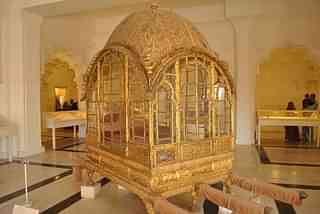 A royal palanquin on display at the Mehrangarh Museum. (Wikimedia Commons)