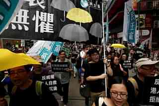 Pro-democracy activists carry a banner reading ‘no fear’, during a protest in Hong Kong.
