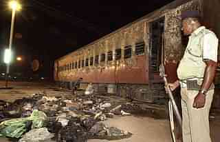 The remains of the Sabarmati Express that was set ablaze (SEBASTIAN D’SOUZA/AFP/Getty Images)