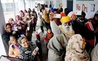 People line up to vote in Punjab. (PTI)