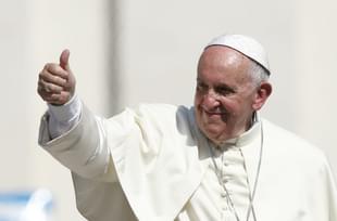 Pope Francis gives a thumbs up as he leaves St. Peter’s Square.