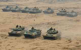Tanks participate in an earlier India-Russia joint military drill at the Mahajan Field Firing Range in Rajasthan around 900 kilometres from Ahmedabad. (SAM PANTHAKY/AFP/GettyImages)&nbsp;