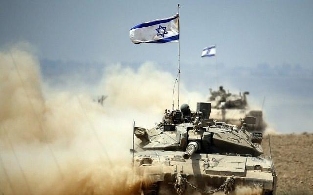 
An Israeli tank 

near Gaza Strip. THOMAS COEX/AFP/Getty 

