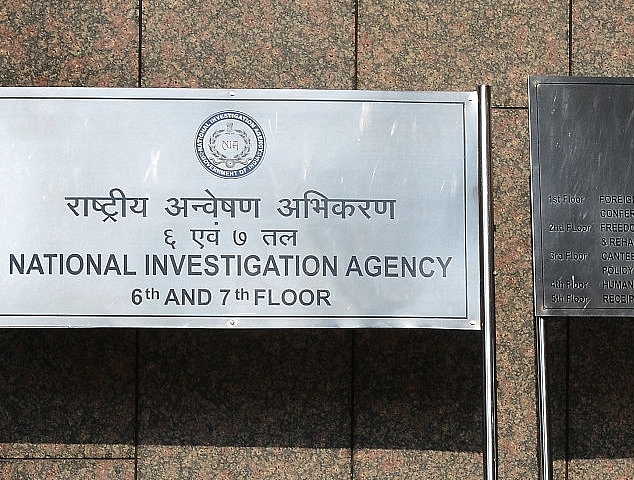 Sign board outside the office of NIA. (MONEY SHARMA/AFP/Getty Images)