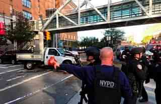 NYPD officials at the site of the attack and the truck that killed eight people