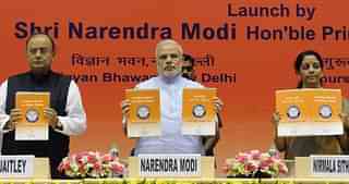 PM Modi, FM Jaitley and Nirmala Sitharaman launching the Jan Dhan Yojana (Mohd Zakir/Hindustan Times via Getty Images)