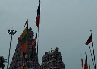 Flags of political parties hoisted around the temple.