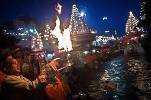 A Hindu priest performs the morning Ganga Arti Puja before sunrise on the banks of the Ganges river in Haridwar. (Daniel Berehulak/Getty Images)