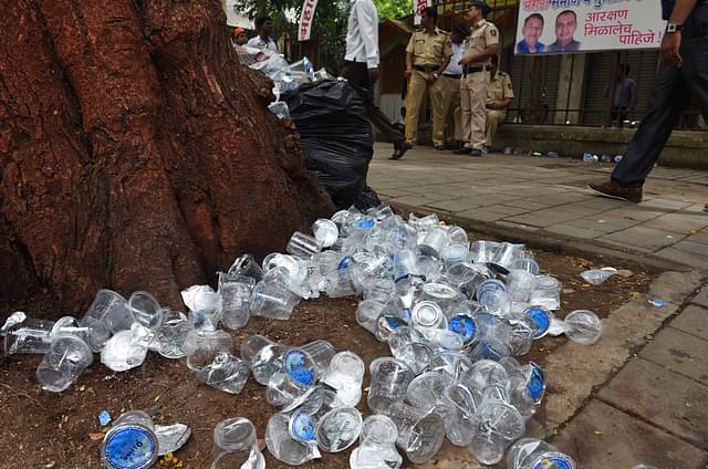 Plastic bottles lying on a street in Mumbai (Satyabrata Tripathy/Hindustan Times via Getty Images)