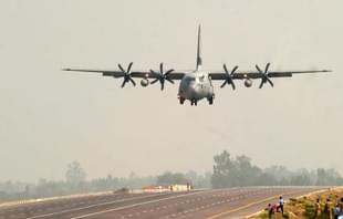 An Indian Air Force Hercules C-130J prepares to touch down at the Agra-Lucknow Expressway. (SANJAY KANOJIA/AFP/Getty Images)
