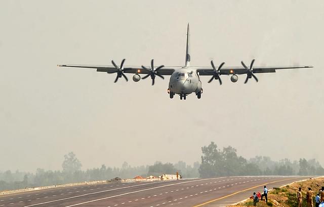 An Indian Air Force Hercules C-130J prepares to touch down at the Agra-Lucknow Expressway. (SANJAY KANOJIA/AFP/Getty Images)