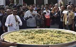 A team of nearly two dozen people cooked khichdi on 4 November in New Delhi in an attempt to enter Guinness World Records at World Food India fair. (Sonu Mehta/Hindustan Times via GettyImages)