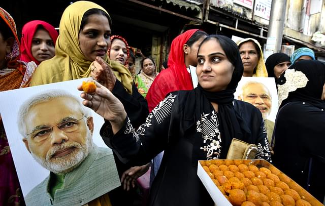 Muslim women celebrating the ban on Triple Talaq. (Anshuman Poyrekar/Hindustan Times via Getty Images)