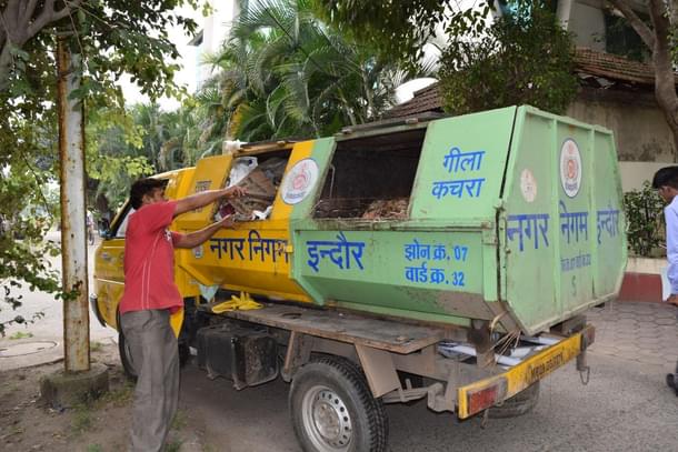 Municipal waste collection truck on one if its early morning drives.