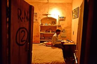 A student studying in his hostel room in Raebareli. (Pradeep Gaur/Mint via GettyImages) 