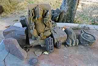  Statue of Lord Ganesha among the relics strewn within the wall found in the jungle of Raisen.