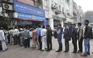 People outside Bank of India (Raj K Raj/Hindustan Times via Getty Images)&nbsp;