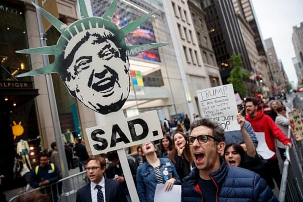 Protestors rally against President Donald Trump and his policies down the street from Trump Tower in New York City. (Drew Angerer/Getty Images)