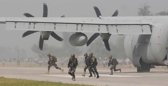 Commandoes take their position after alighting from C- 130 J. (Subhankar Chakraborty/Hindustan Times/ Getty Images)