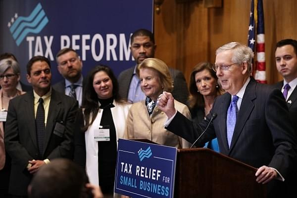 Pumping his fist, Senate Majority Leader Mitch McConnell (R-KY) addresses a tax reform news conference with Sen. Shelley Moore Capito (R-WV)  on Capitol Hill in Washington, DC. (Chip Somodevilla/Getty Images)