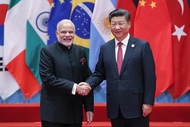 Chinese President Xi Jinping with Prime Minister Narendra Modi. (Lintao Zhang via Getty Images)