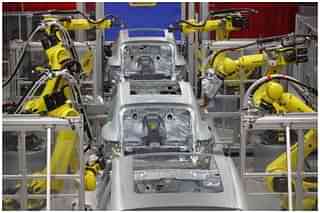 Robots weld the bodies of Porsche Macan SUVs at the new Porsche Macan factory at the Porsche plant on February 11, 2014 in Leipzig, Germany. (Sean Gallup/Getty Images)