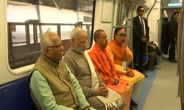 PM Modi rides on board the newly-inaugurated Delhi metro Magenta Line.