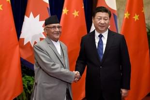 Chinese President Xi Jinping, right, shakes hands with K P Sharma Oli inside the Great Hall of the People in Beijing. (Etienne Oliveau/Getty Images)