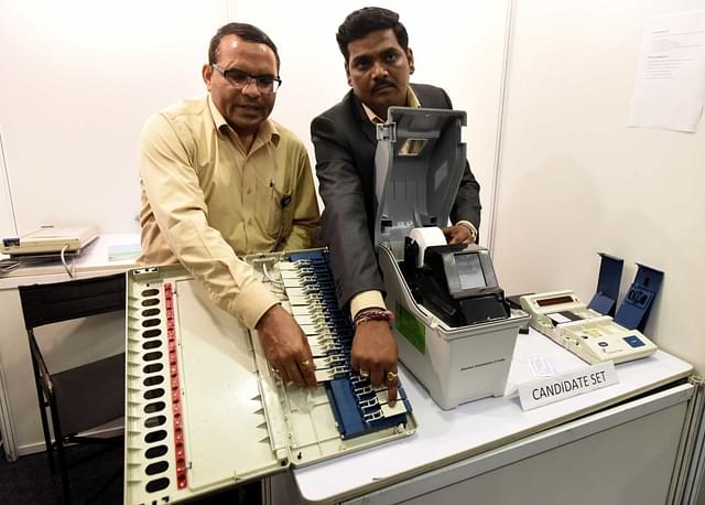  Election Commission of India officers conduct a live demonstration of the workings of the EVM and VVPAT machines ahead of announcing the schedule and process for its EVM challenge, at Vigyan Bhawan on May 20, 2017 in New Delhi (Sonu Mehta/Hindustan Times via Getty Images)