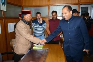 Jairam Thakur, right, meets senior BJP leaders in Shimla. (Deepak Sansta/Hindustan Times via Getty Images) 