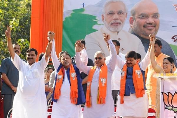 It all began when Mamata’s former aide Mukul Roy (second from left) joined the BJP.  (Samir Jana/Hindustan Times via Getty Images)