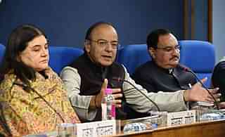 Finance Minister Arun Jaitley (centre) with Women and Child Development Minister Maneka Gandhi (left) and Health Minister J P Nadda. (Mohd Zakir/Hindustan Times via Getty Images)
